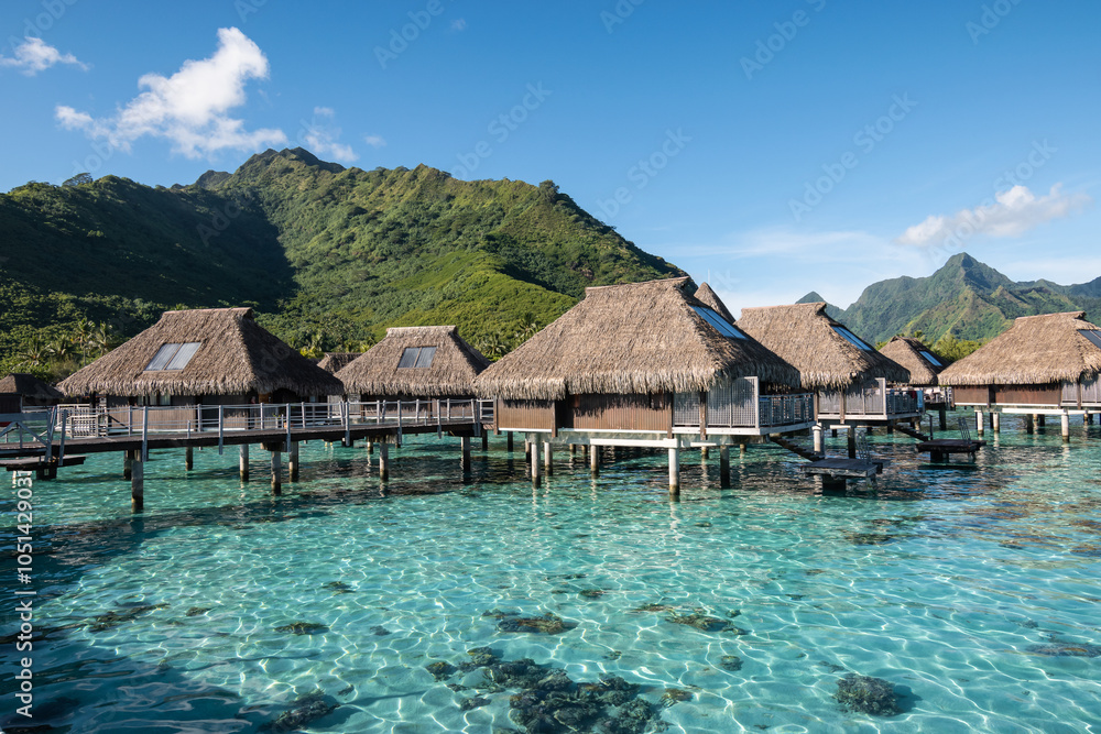 Luxury Overwater Bungalows in Tropical Lagoon at Beautiful Mountains in Moorea, French Polynesia