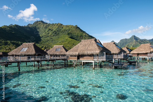 Obraz na płótnie Luxury Overwater Bungalows in Tropical Lagoon at Beautiful Mountains in Moorea, French Polynesia w salonie