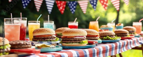 Colorful outdoor barbecue table with burgers and drinks for summer celebration.