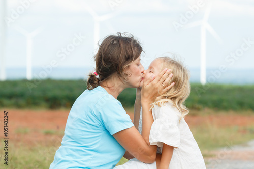 Mother and daughter enjoy and relaxing in the nature.