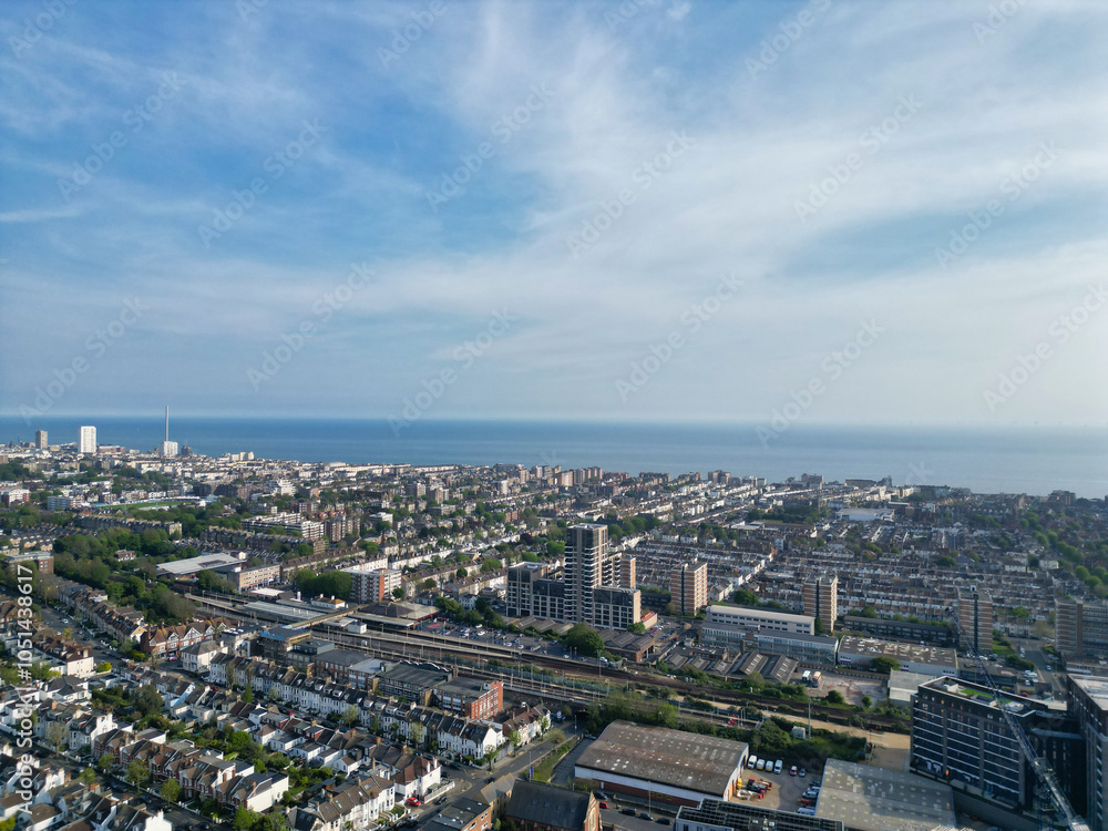 Fototapeta premium High Angle View of Most Beautiful and Attractive British Tourist Attraction of Brighton seaside resort and Beach City of East Sussex, England GB. Footage Captured with Drone's Camera on May 9th, 2024