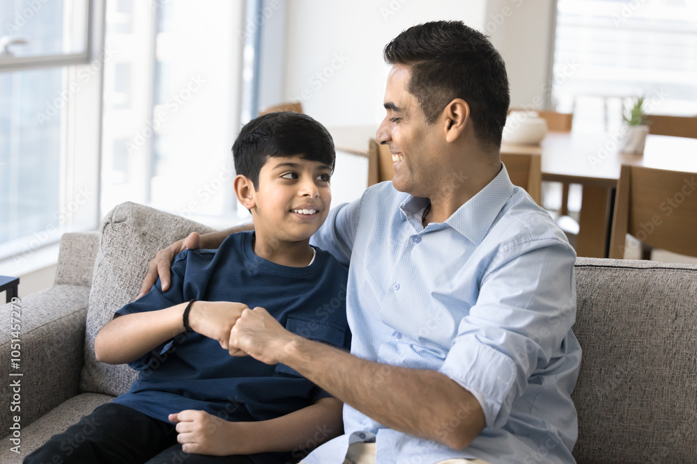 Happy Indian dad and teenage son making fist bump friends gesture ...