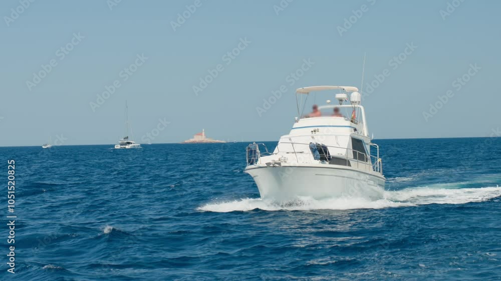 Luxurious motorboat in sea on summer day. Summer vacation and tourism Luxurious motorboat in sea on summer day. Summer vacation and tourism