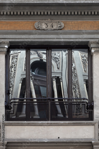 Wallpaper Mural A window in a classic style, in the glass of which another window is reflected. Torontodigital.ca