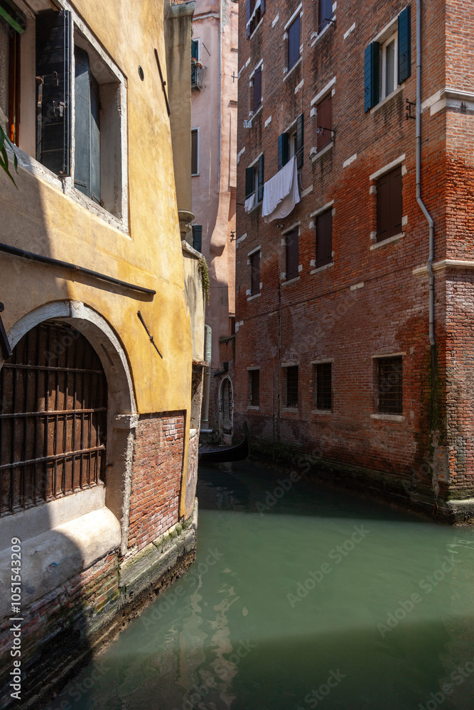 custom made wallpaper toronto digitalView of a Venetian canal. Two old Venetian houses standing on the canal.