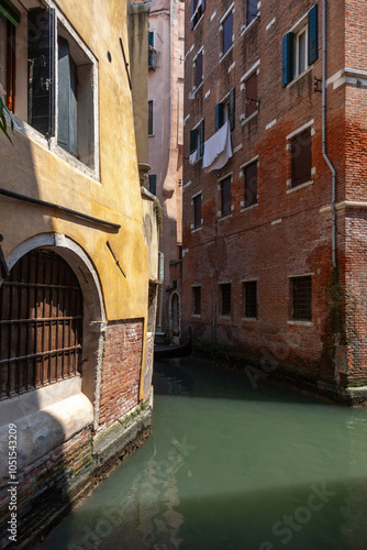 Wallpaper Mural View of a Venetian canal. Two old Venetian houses standing on the canal. Torontodigital.ca