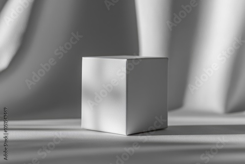 White box on a textured white surface, a minimal product display mockup.