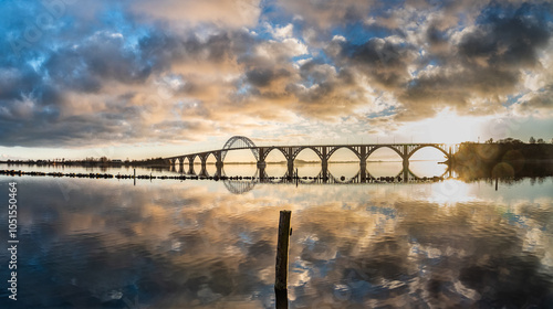 Fotografía Sunset Over Serene Harbor With Queen Louise Scenic Bridge, Denmark