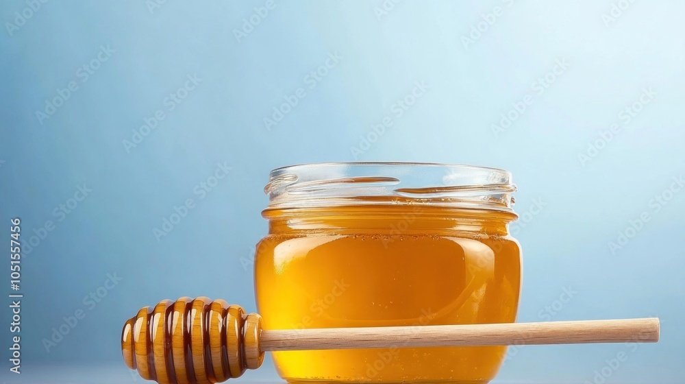 Honey in Glass Jar with Wooden Dipper Honey in Glass Jar with Wooden Dipper