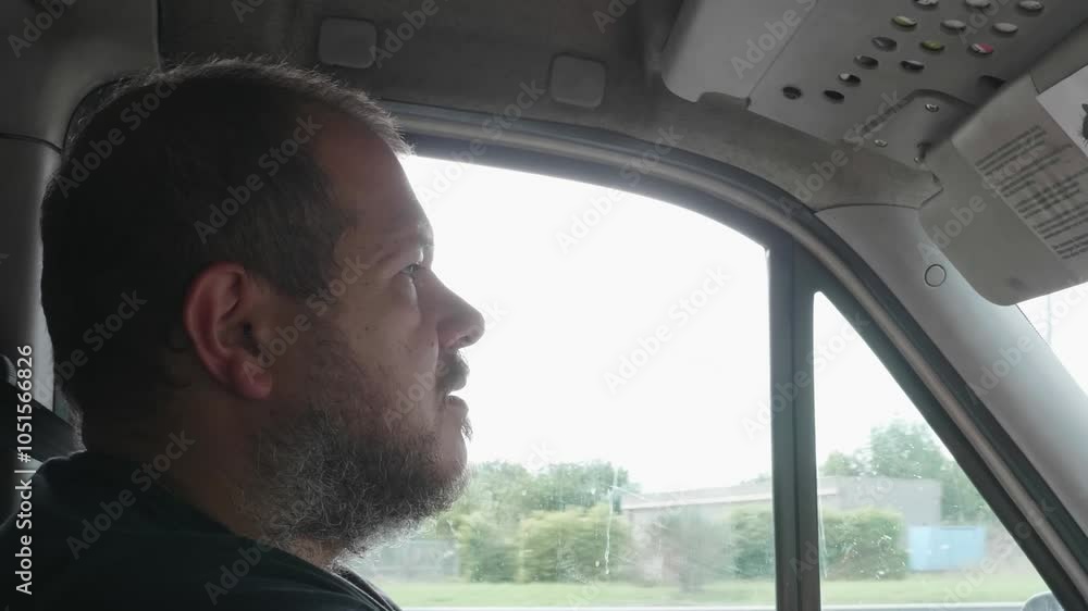 A truck driver experiences a moment of drowsiness during the journey but wakes up just in time to maintain control of the vehicle. A truck driver experiences a moment of drowsiness during the journey but wakes up just in time to maintain control of the vehicle.