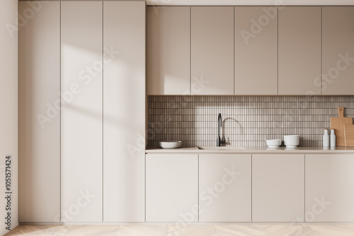 Beige modern home kitchen interior with cooking cabinet and kitchenware