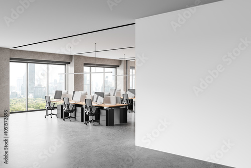 Light coworking interior with pc computers in row, panoramic window. Mockup wall photo