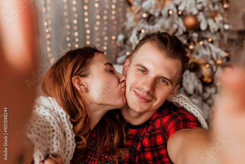 young couple in love taking selfie, christmas concept, holidays