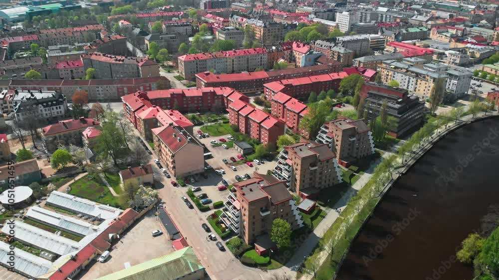 Aerial drone view over Orebro city along side a dark river. Aerial drone view over Orebro city along side a dark river.