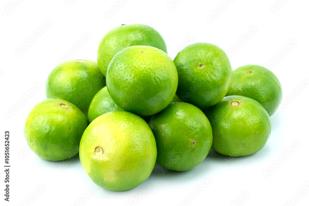 Heap of fresh lime fruits isolated on white background close up stacking Heap of fresh lime fruits isolated on white background close up stacking