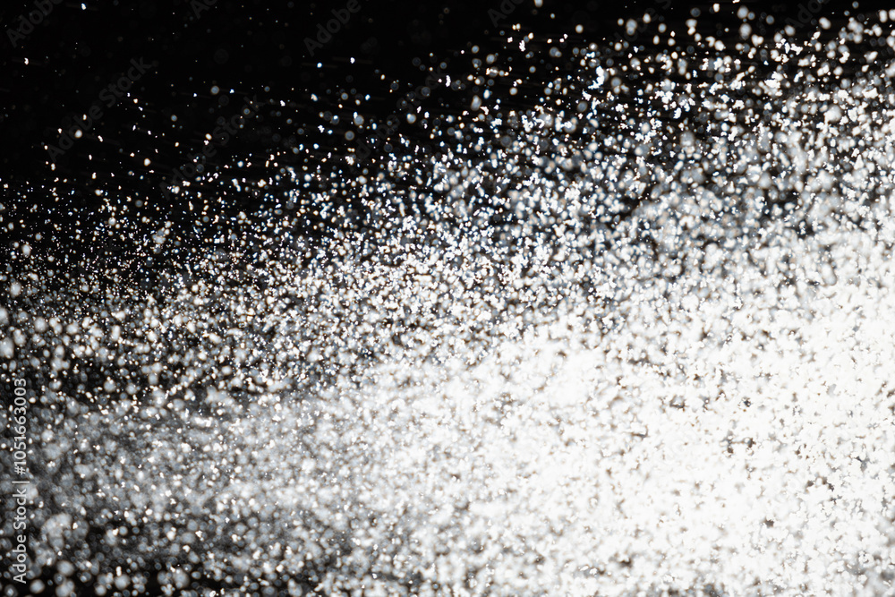 Abstract black and white background of pouring flour, space for text Abstract black and white background of pouring flour, space for text