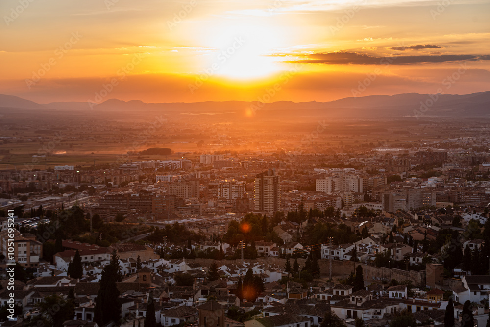 Warm vibrant sunset above the city of Granada, Andalusia, Spain, Europe Warm vibrant sunset above the city of Granada, Andalusia, Spain, Europe