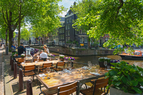 Restaurant tables by Brouwersgracht canal, Amsterdam, The Netherlands, Europe photo