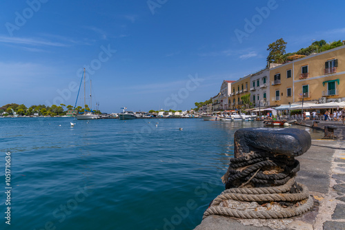 View of boats and restaurants in Porto d'Ischia (Port of Ischia), Island of Ischia, Campania, Italy, Europe photo