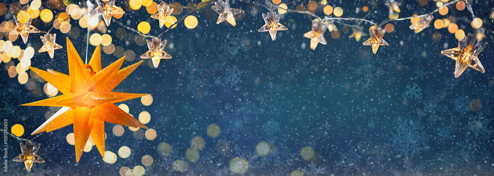 Christmas tree with Christmas balls on the background of the night sky - decorations on fir branches with shiny and unfocused lights and snowflakes on an abstract background