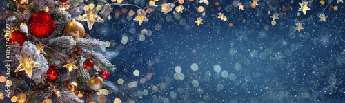 Obraz na płótnie Christmas tree with Christmas balls on the background of the night sky - decorations on fir branches with shiny and unfocused lights and snowflakes on an abstract background w salonie