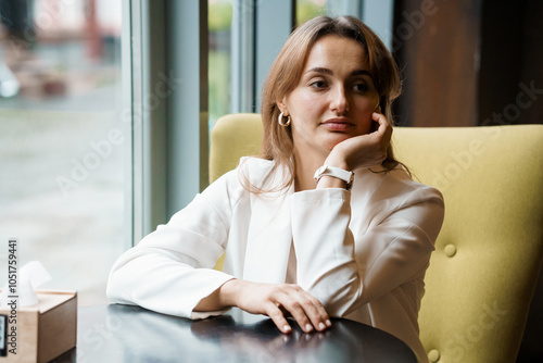 Thoughtful Woman in White Blazer Sitting at Cafe Table Free Download Thoughtful Woman in White Blazer Sitting at Cafe Table - GFXLoad