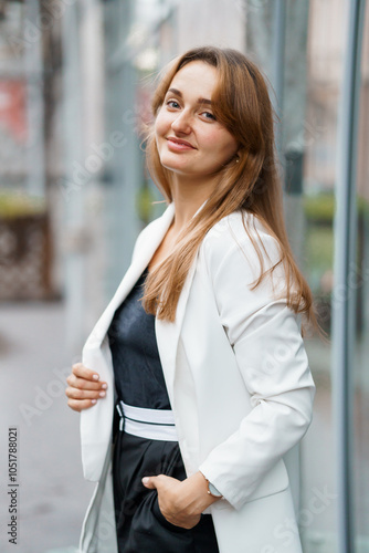 Elegant Young Woman Posing Outdoors in Chic Outfit