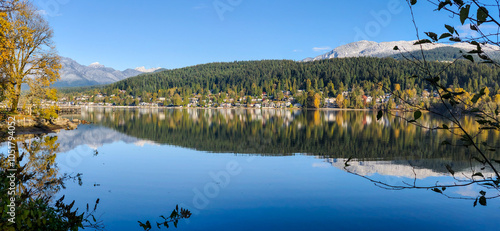 Shoreline forest and mountain reflections in Burrard Inlet, Vancouver, British Columbia, Canada photo