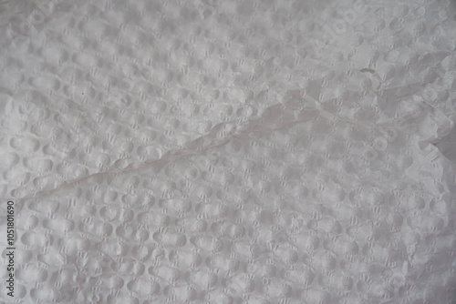 Recycled perforated white paper close up texture. Old paper background.