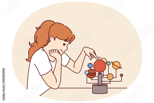 Little girl is studying solar system and location of planets in space, wanting to become astronomer. Schoolgirl teenager with visual aid for teaching children astronomy and science space exploration