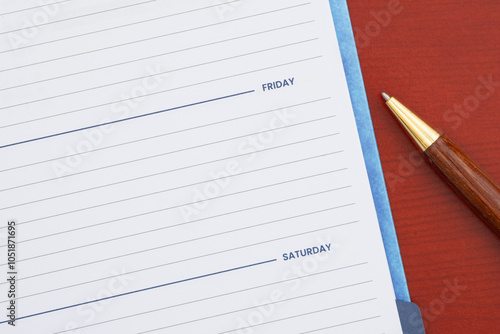 Wallpaper Mural Empty day planner with Friday and pen on desk Torontodigital.ca