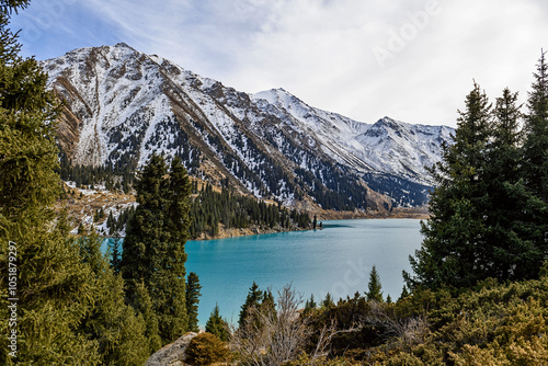 Fototapeta Naklejka Na Ścianę i Meble -  Beautiful mountain lake with ice and snow. Big Almaty lake in winter time. Kazakhstan.