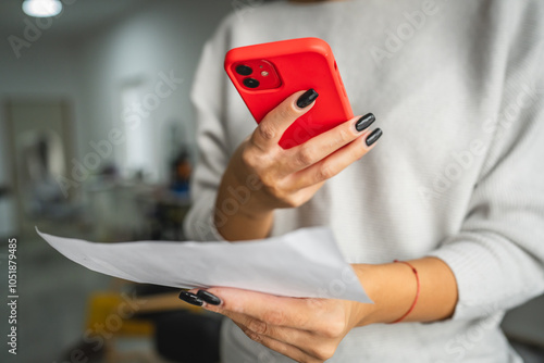 woman do contactleess payment on cellphone and pay bills