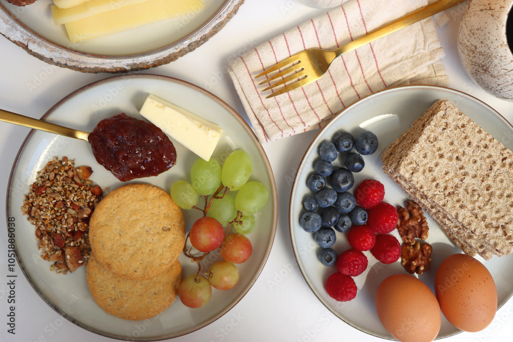Assortment of various breakfast foods and drinks on the white table. Flat lay. Assortment of various breakfast foods and drinks on the white table. Flat lay.