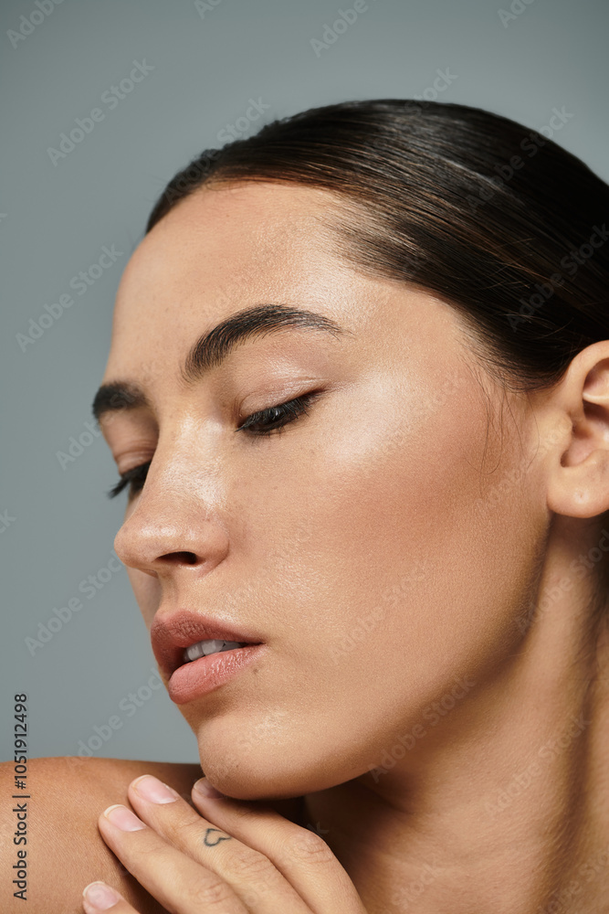 A beautiful woman elegantly poses with a gentle expression, showcasing her natural beauty and grace. A beautiful woman elegantly poses with a gentle expression, showcasing her natural beauty and grace.