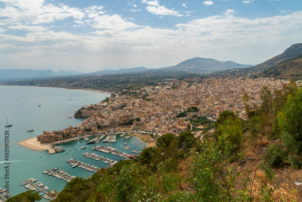 Obraz premium Aerial morning cityscape of Castellammare del Golfo town, .view of medieval fortress in Cala Marina, harbor, Mediterranean sea. Sicily, Trapani Province, Europe. Traveling concept background.