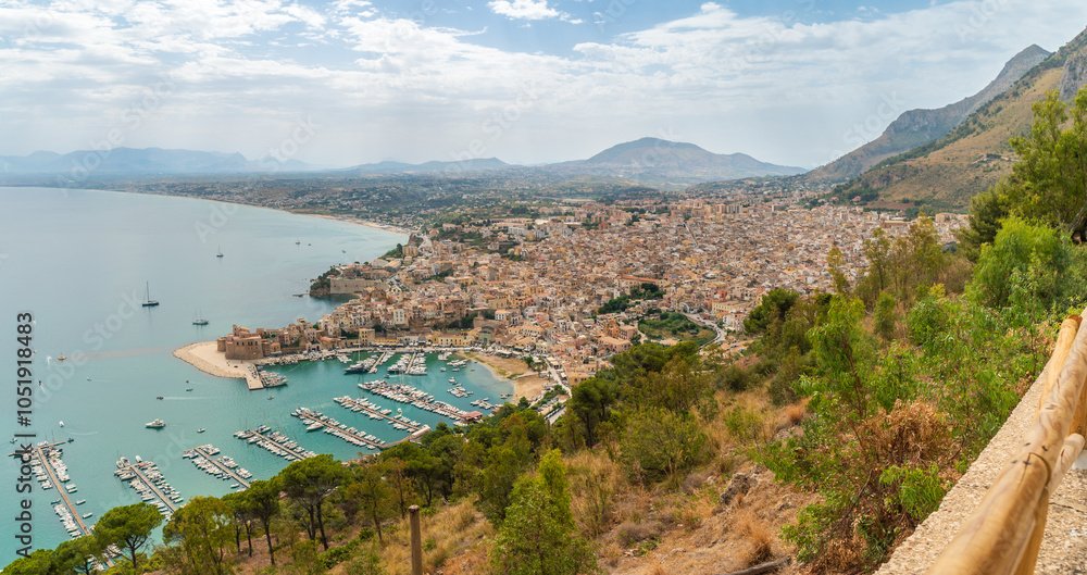Fototapeta premium Aerial morning cityscape of Castellammare del Golfo town, .view of medieval fortress in Cala Marina, harbor, Mediterranean sea. Sicily, Trapani Province, Europe. Traveling concept background.