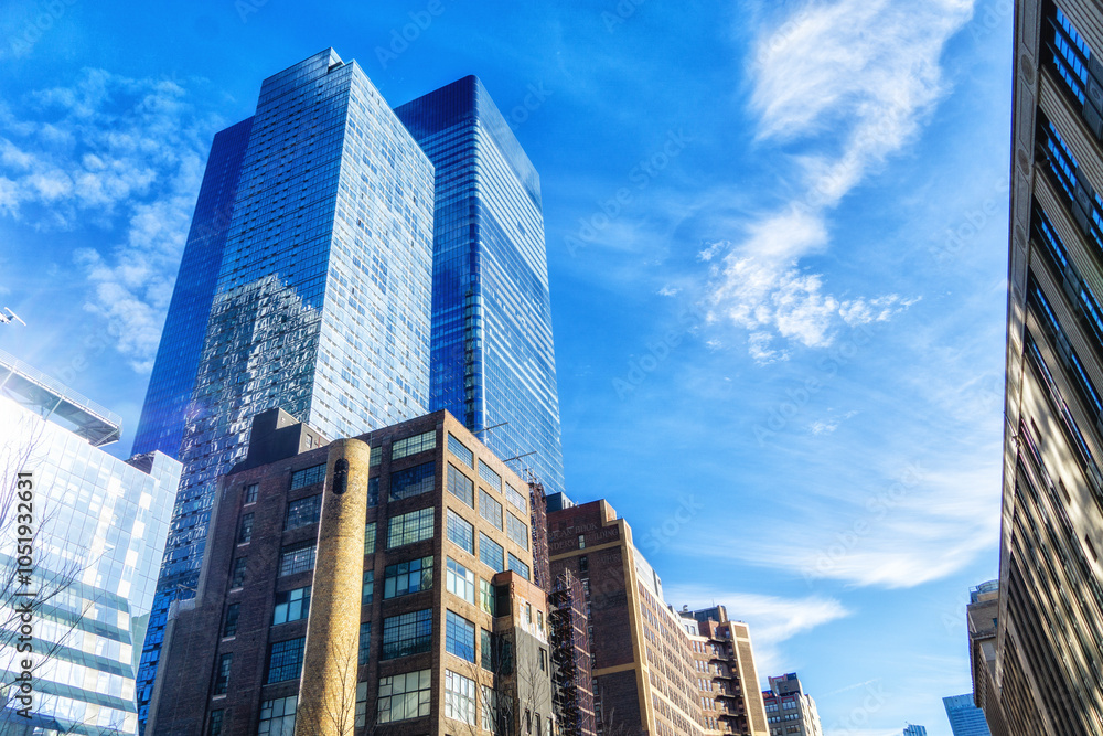 Fototapeta premium low angle view of concrete and glass buildings in midtown of New York City