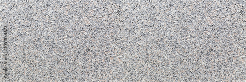 Fotografie Granite texture with speckled light gray, black, and pale pink tones, offering a natural, rough stone look