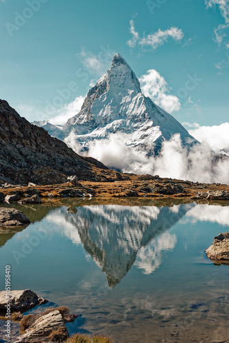 Matterhorn in the Swiss Alps. Iconic landmark in autumn, famous mountain near Zermatt, canton of Valais, Wallis in Switzerland. Scenic Matterhorn reflection in alpine lake.