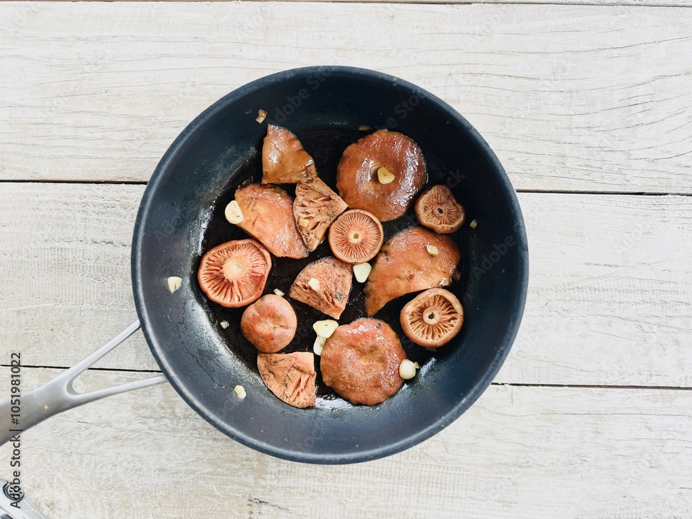 Cooked edible orange mushrooms. Lactarius deliciosus.
Cooked edible orange mushrooms. Lactarius deliciosus.