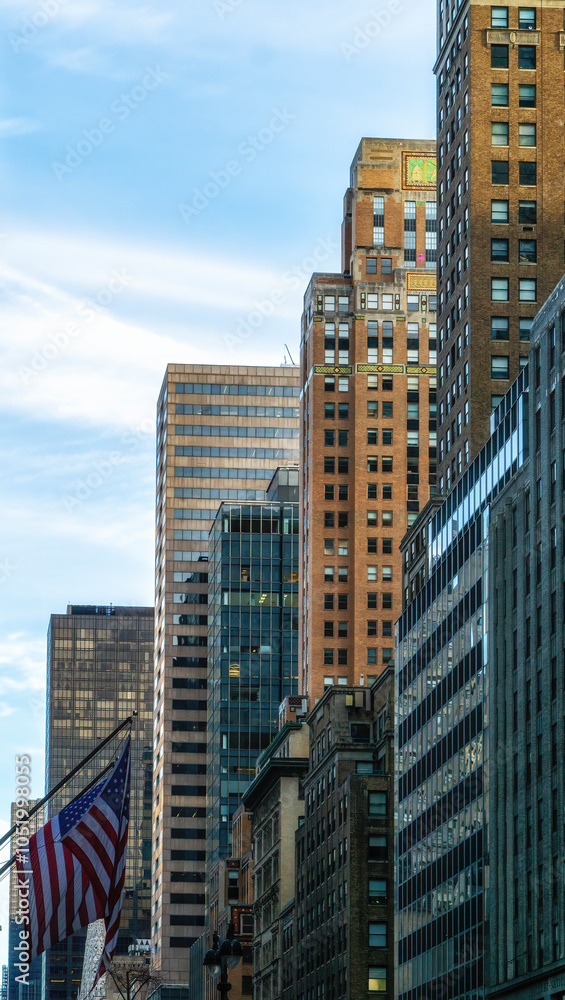 low angle view of concrete and glass buildings in midtown of New York City low angle view of concrete and glass buildings in midtown of New York City