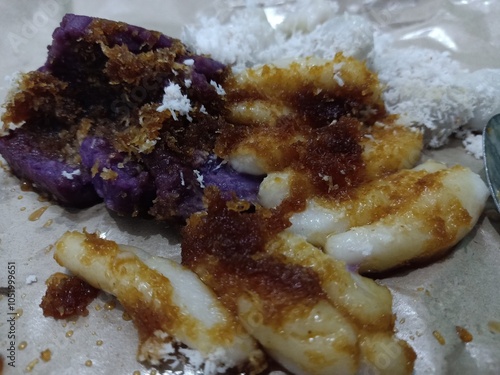 traditional food coated with palm sugar and a little grated young coconut