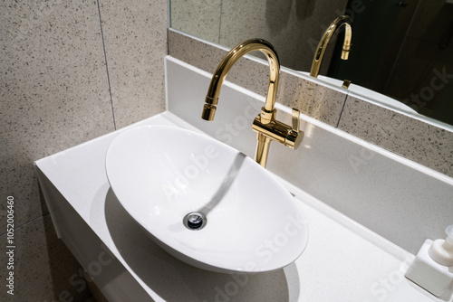 washbasin and faucet in the hotel bathroom photo