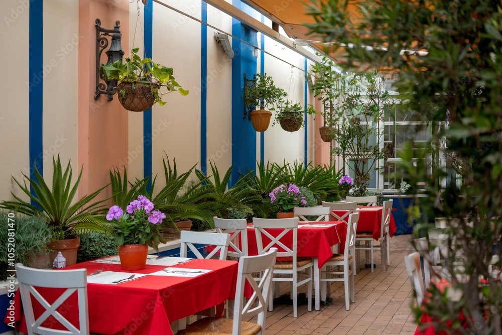 Charming Outdoor Cafe with Red Tablecloths Charming Outdoor Cafe with Red Tablecloths