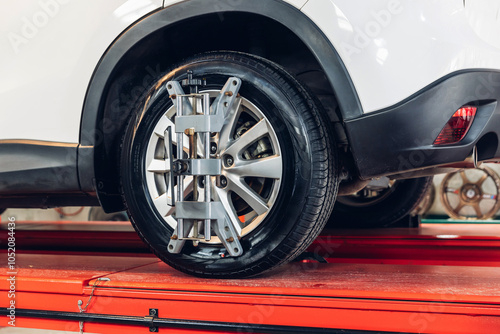 Wallpaper Mural Car wheel centering machine adjustment. Auto service mechanic installing wheel alignment sensor on tire during vehicle suspension alignment adjustment Torontodigital.ca