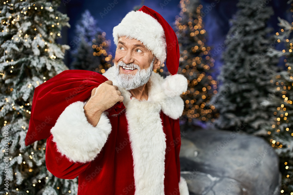 A cheerful figure in a red suit and hat holds a sack while smiling in a snowy forest. A cheerful figure in a red suit and hat holds a sack while smiling in a snowy forest.