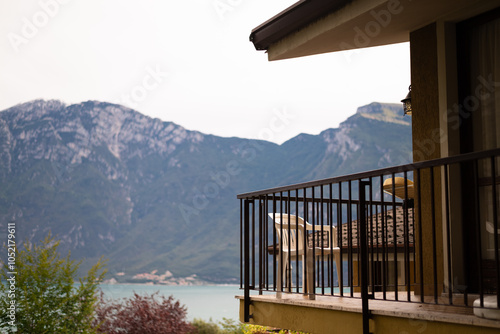 a balcony with transparent curtains and nice view over the mountain.,Beautiful terrace view over the mountain., copy space photo