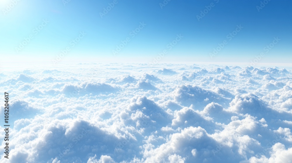 Fototapeta premium A serene view of fluffy clouds under a bright blue sky, evoking tranquility and openness.