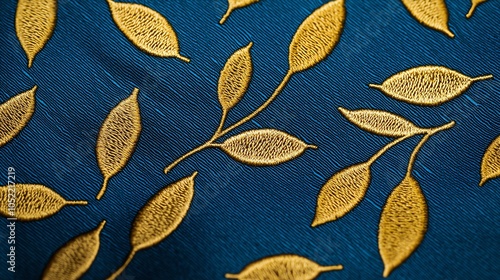 Handmade tie with leaf patterns, lowangle closeup on textured fabric photo